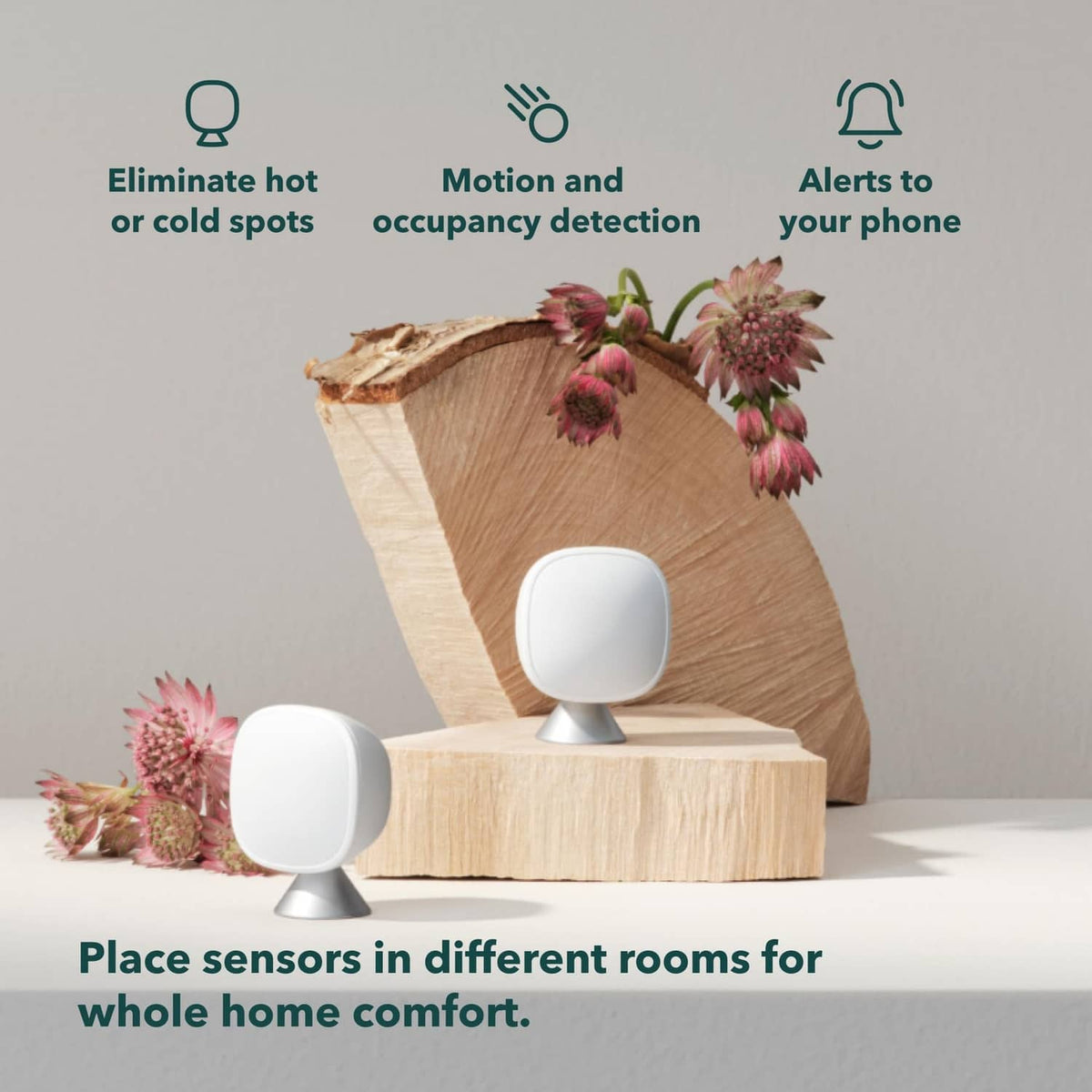 Two white smart sensors on pedestals with hot/cold and motion icons