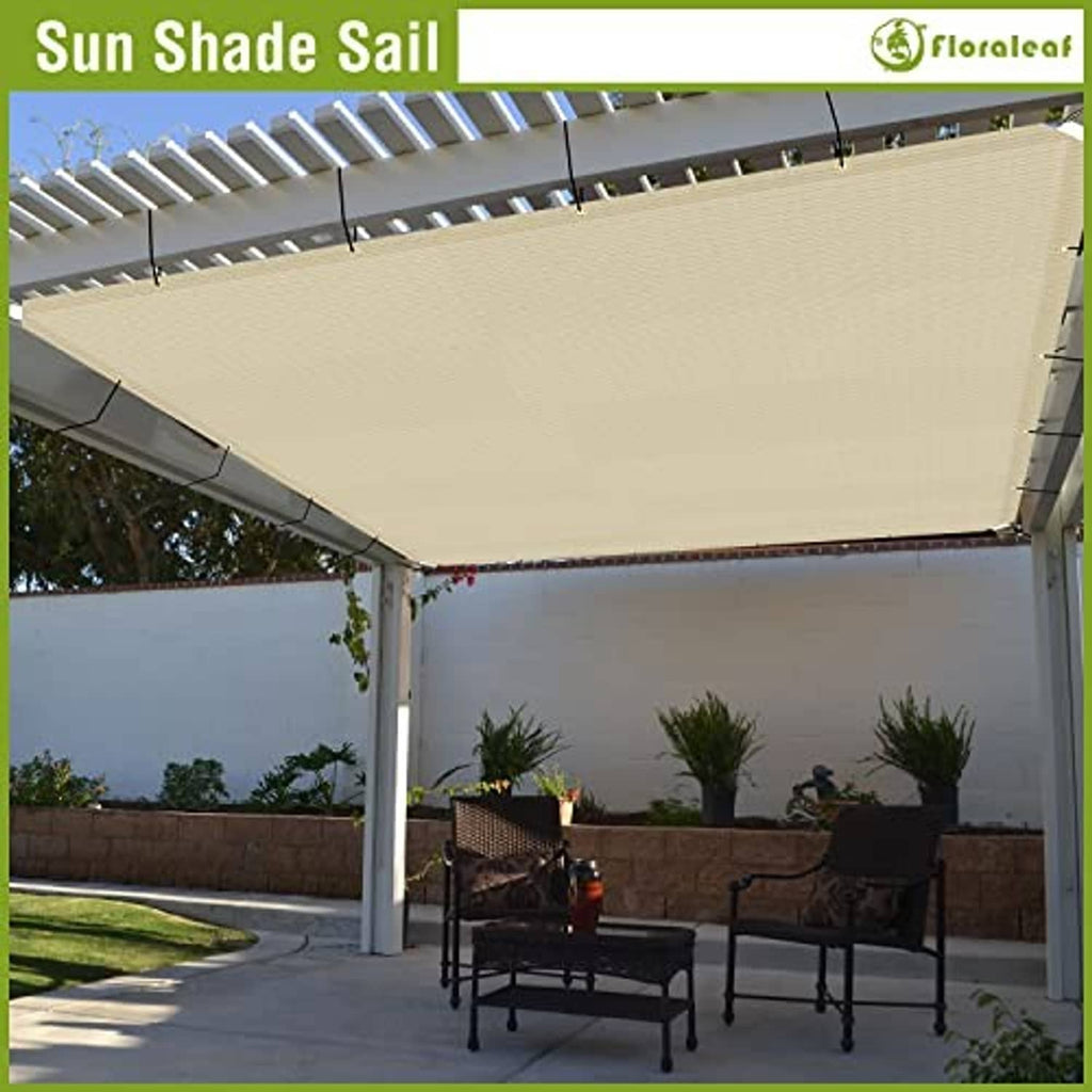 Beige sun shade sail canopy attached to pergola posts over seating area