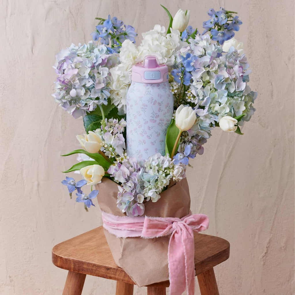 Serene Blooms stainless steel water bottle with pink lid and pastel floral pattern