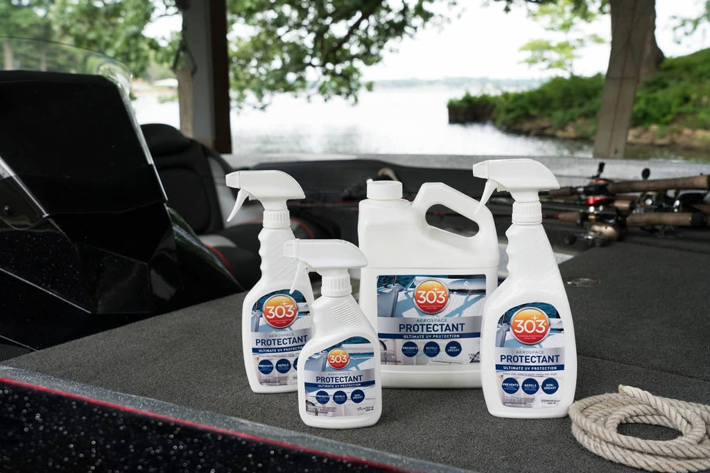 Set of aerospace protectant bottles with white triggers on car seat