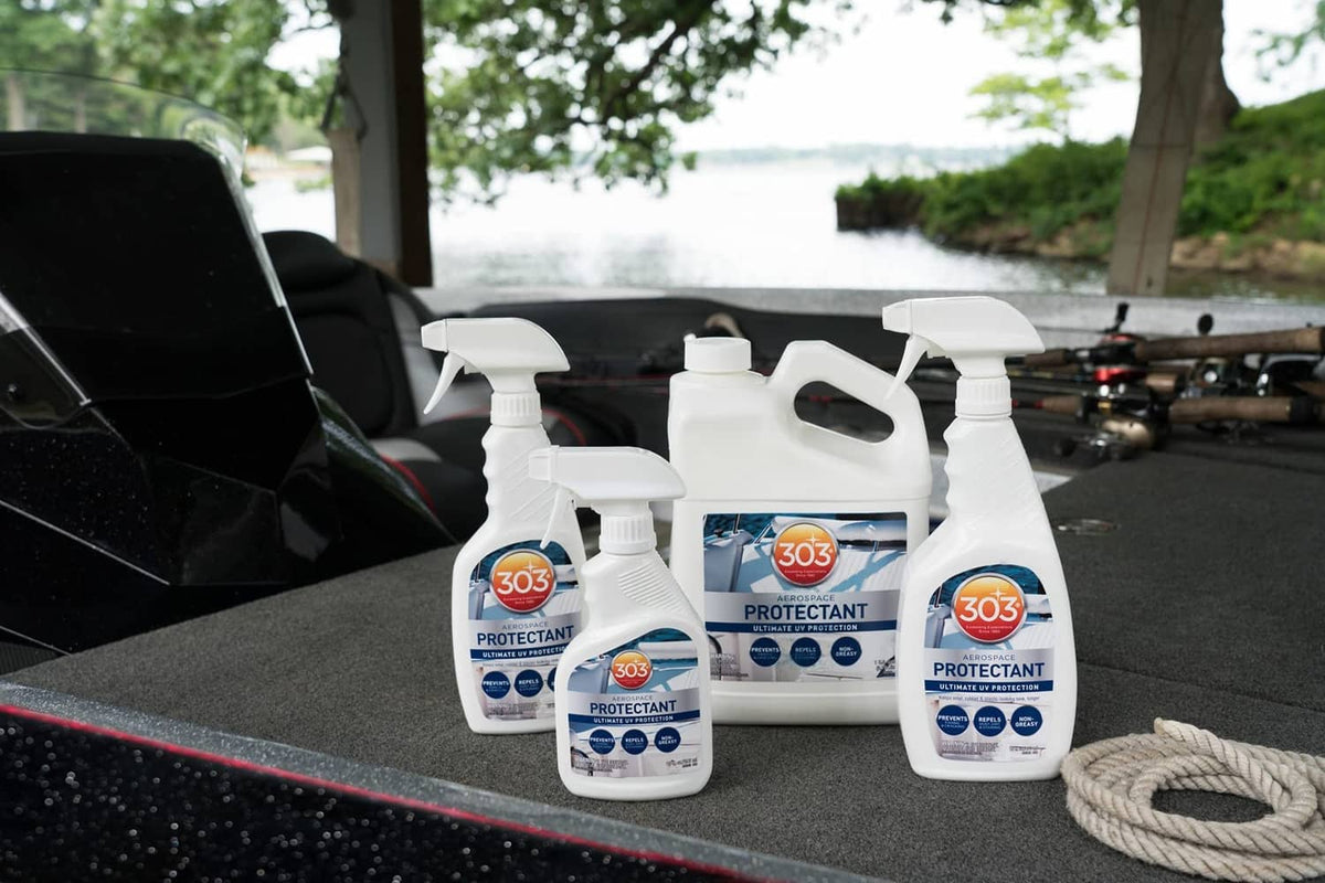 Set of aerospace protectant bottles with white triggers on car seat