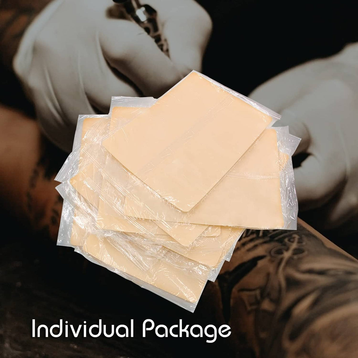 Beige tattoo practice skin sheets in individual clear plastic packaging