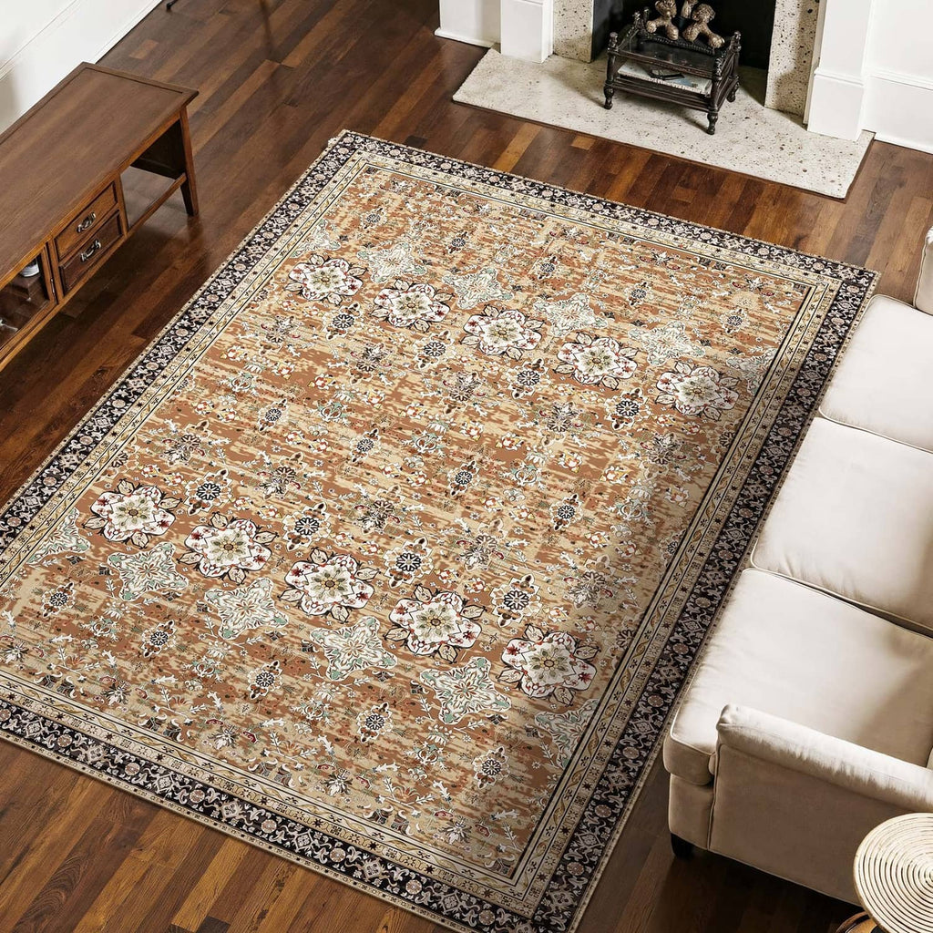 Large vintage area rug with detailed floral motifs and border stripe in tan, cream, and dark blue