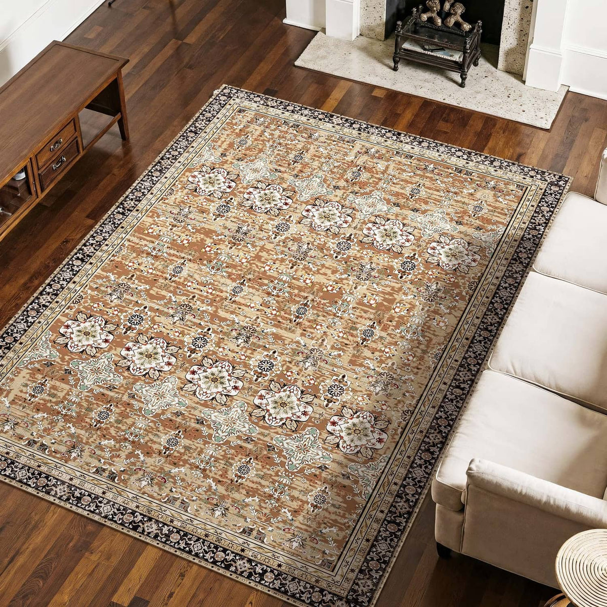 Large vintage area rug with detailed floral motifs and border stripe in tan, cream, and dark blue