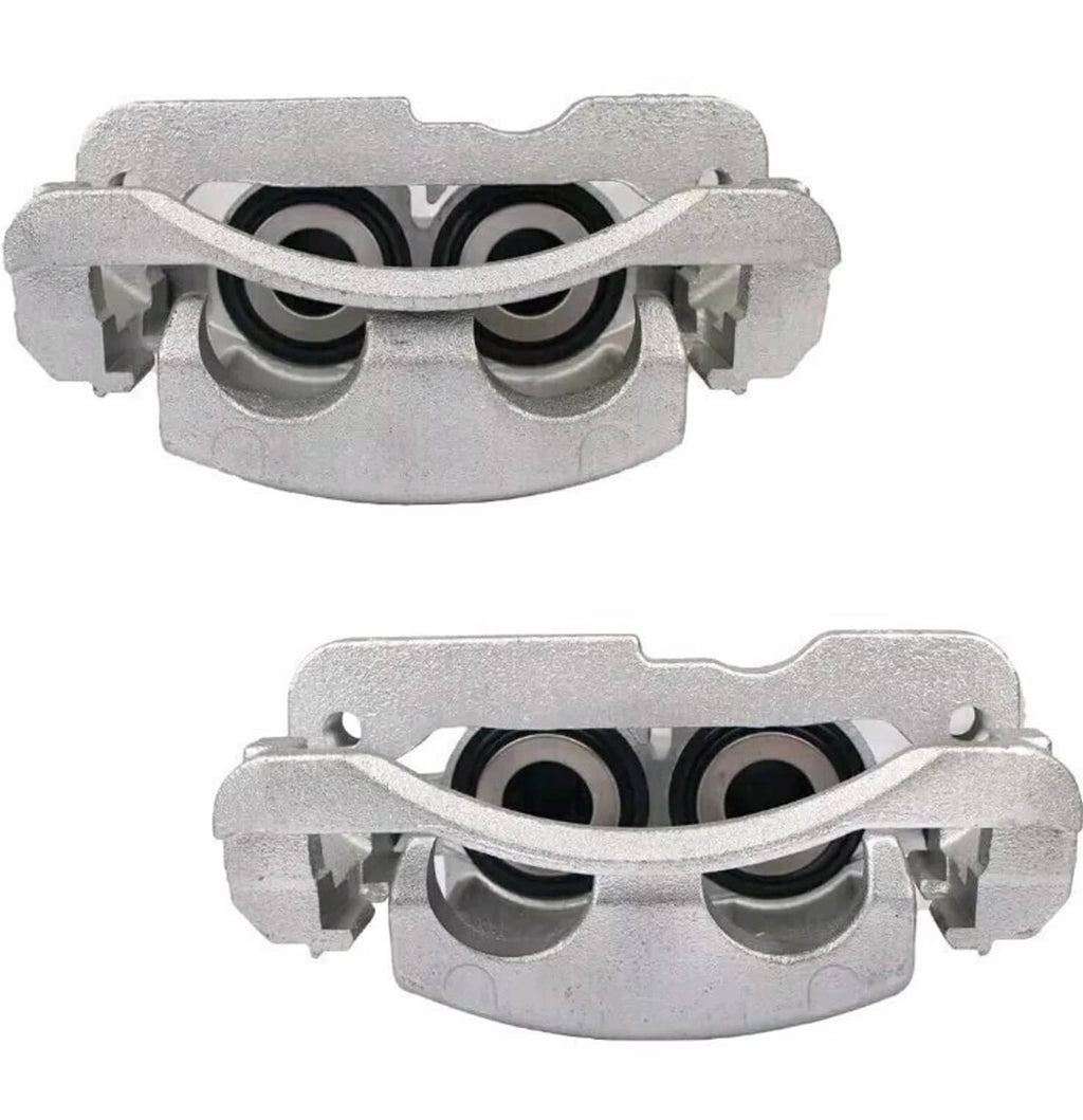 Top-view silver front brake calipers with dual piston bores visible