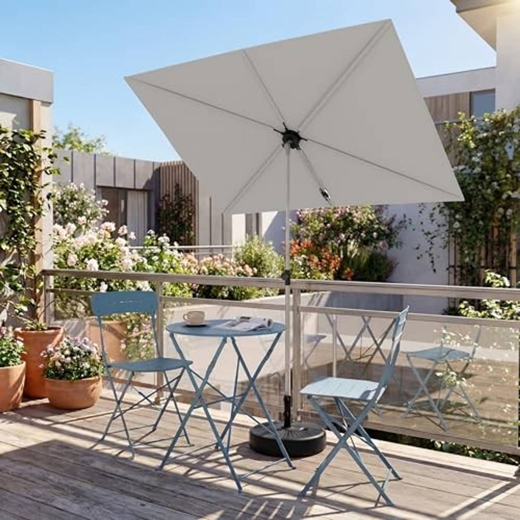 Open beige rectangular balcony umbrella with center pole and black base on outdoor deck
