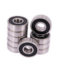 Three double-sealed deep groove ball bearings, metal rings with black rubber seals