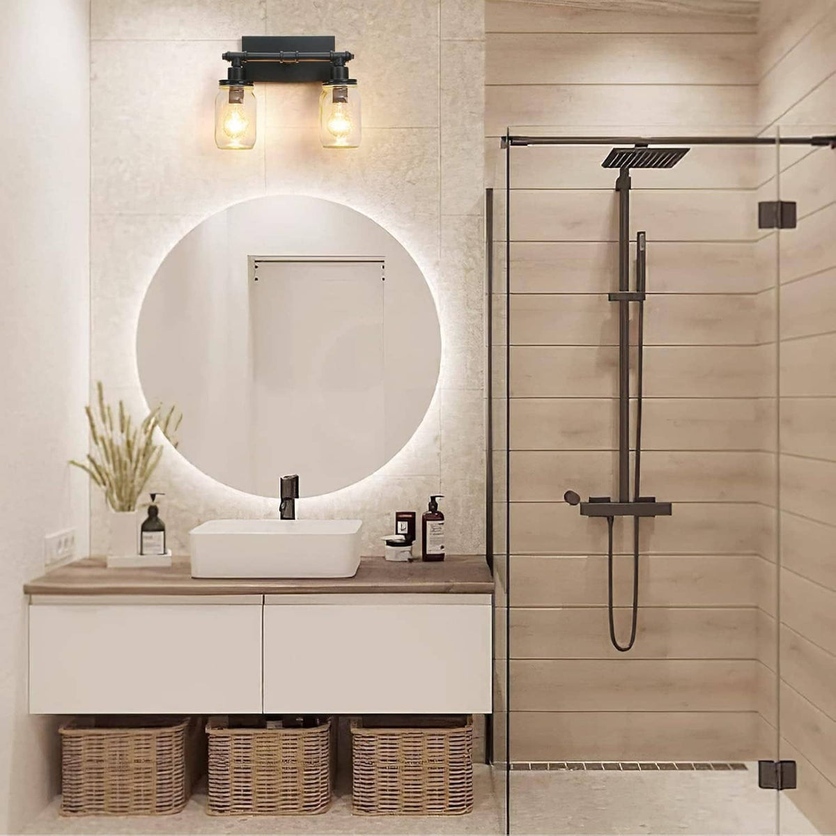 Black 2-light bathroom vanity bar with two clear mason-jar shades above mirror
