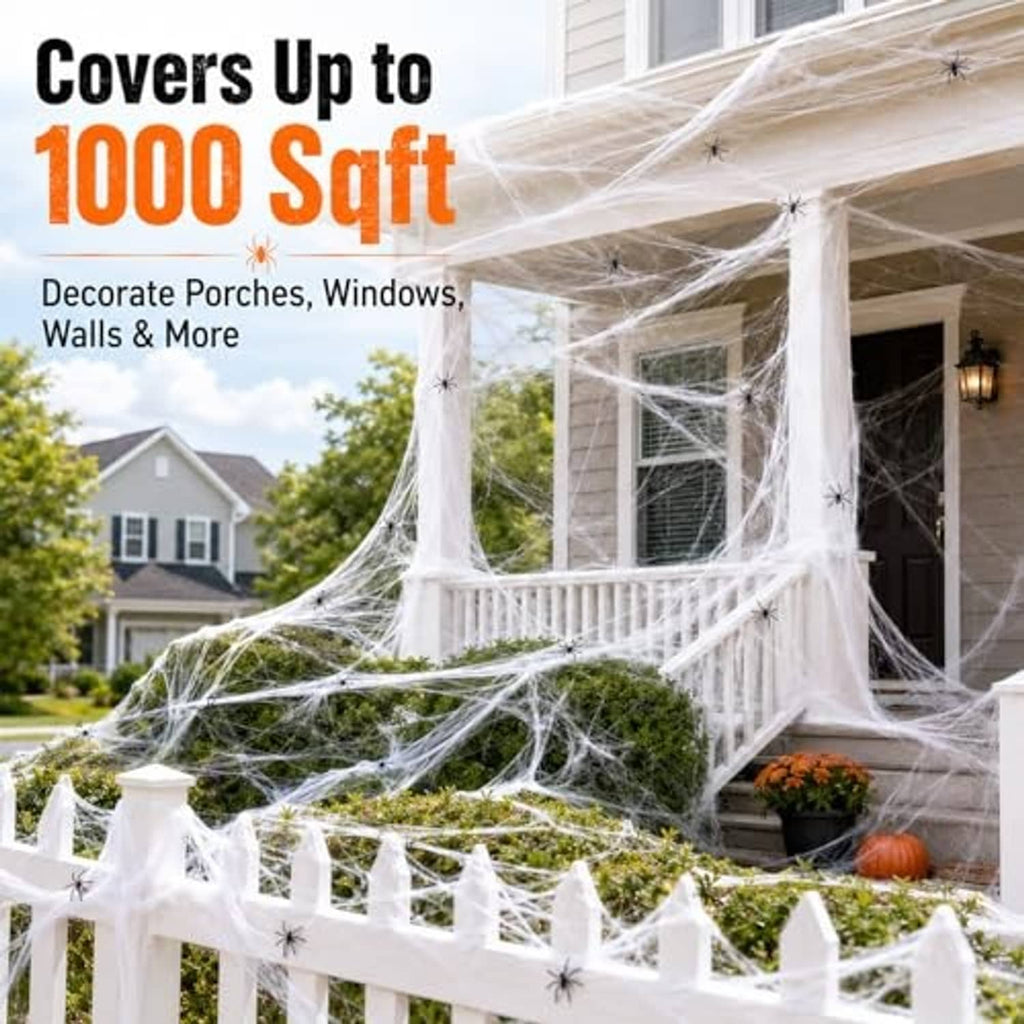 White spider web decor with black spiders, covering porch railing and wall sections