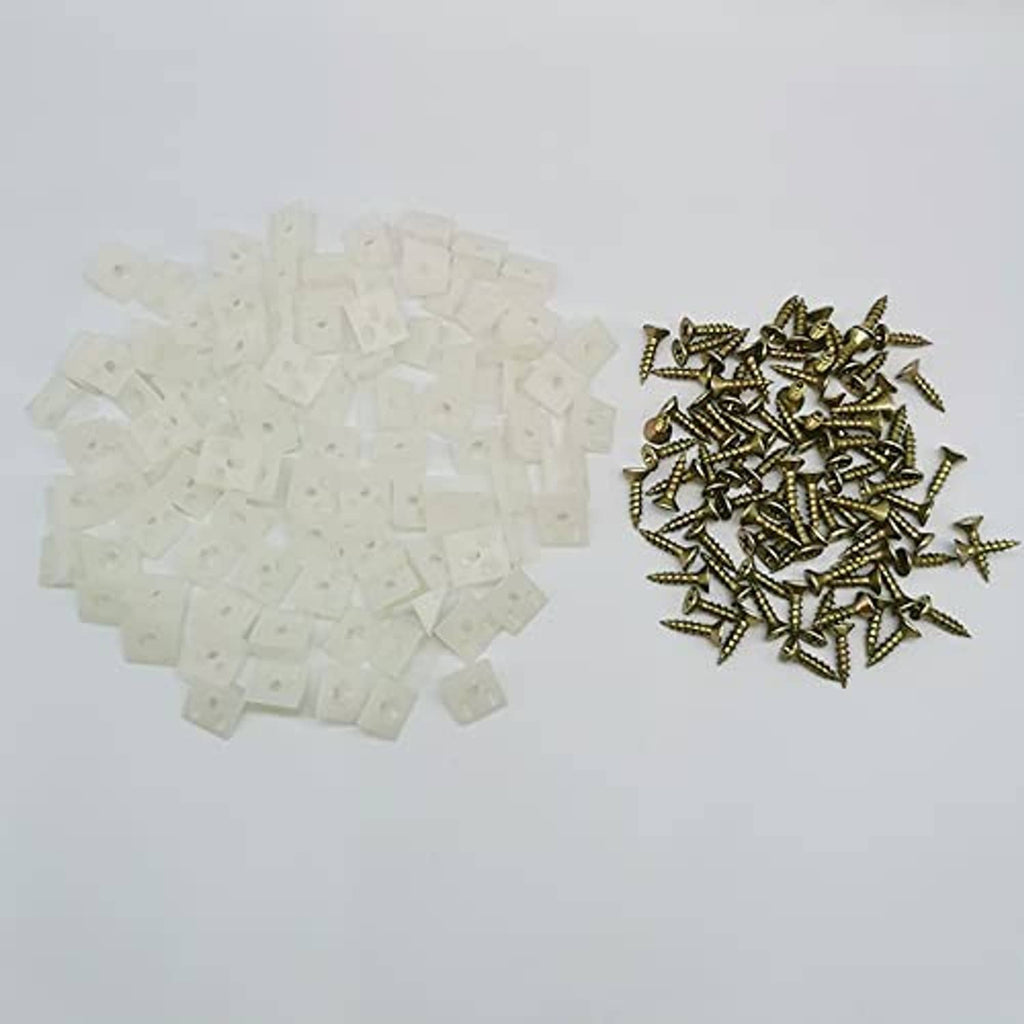 White wedge anchors and small gold screws for furniture drawer repairs