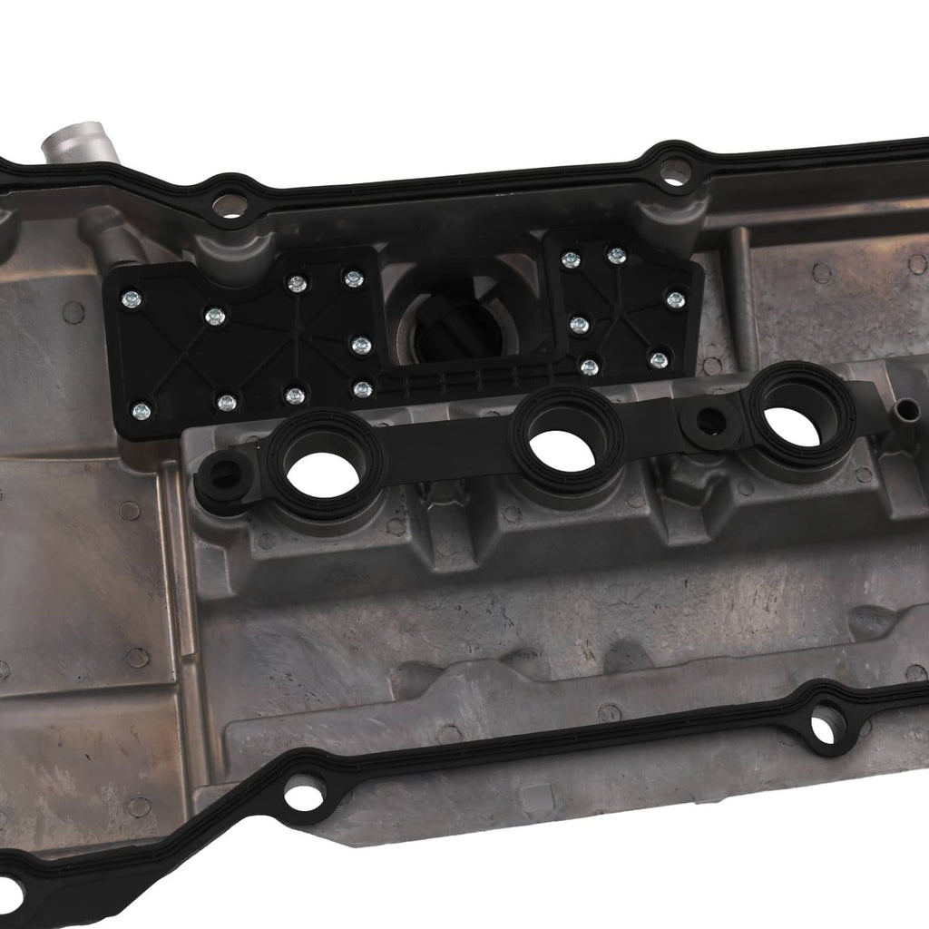 Valve cover interior close-up with bolt plates, circular openings, and gasket edge