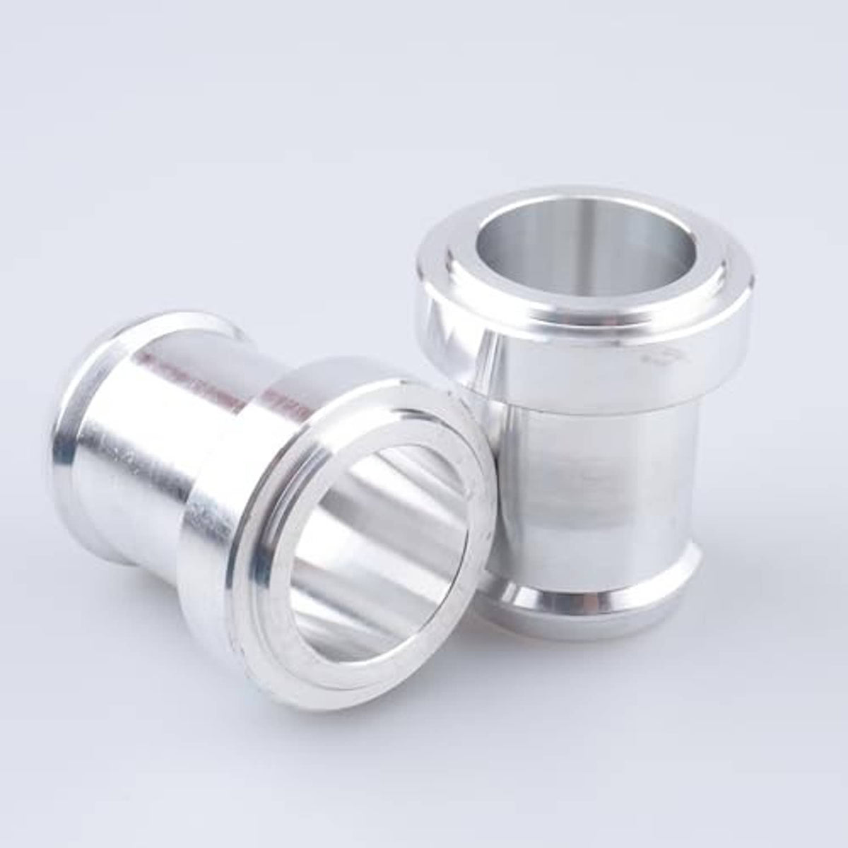 Stainless steel weldable hose barb tail fittings, close view of flanged ends
