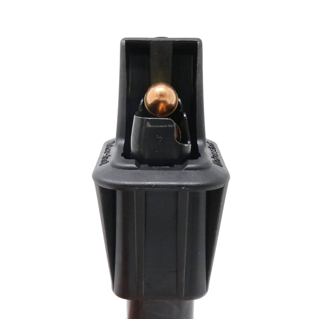 Black speed loader with brass round seated in front loading cavity