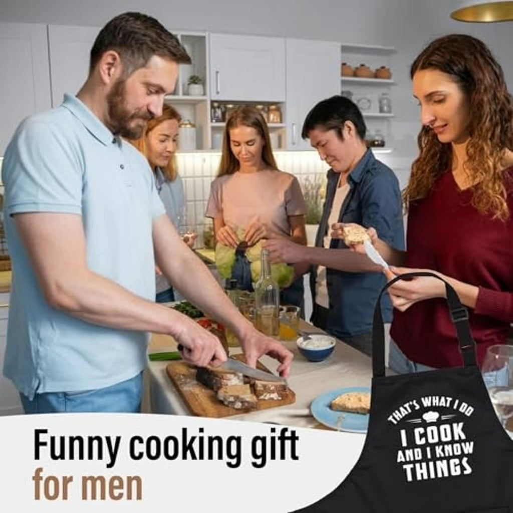 Black cooking apron with “I cook and I know things” slogan and adjustable neck strap