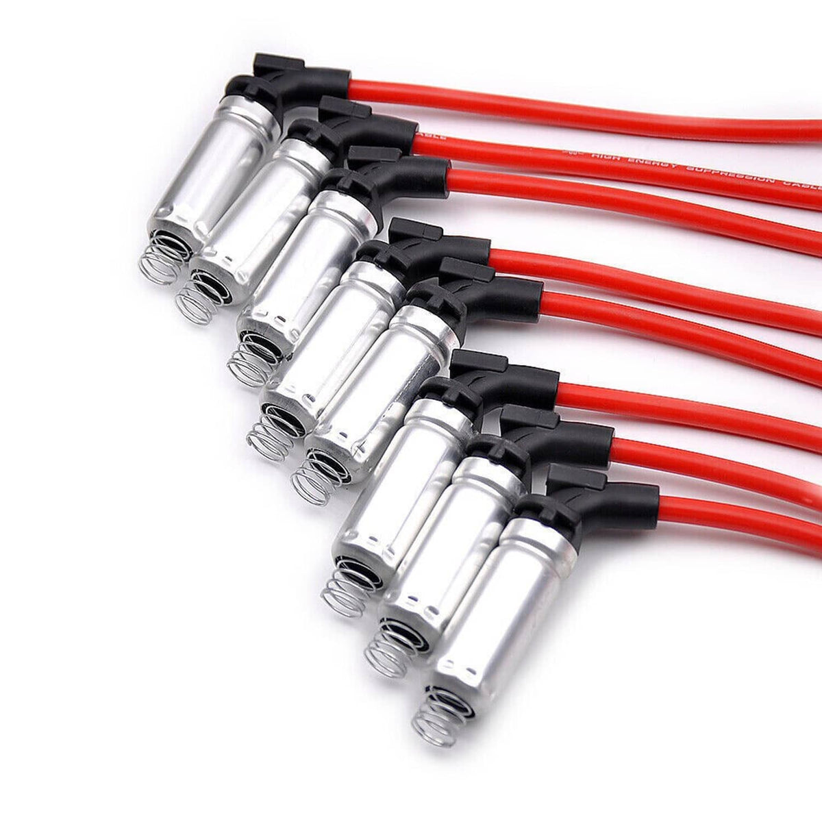 Ignition coil spark plug set with silver coils and multiple red insulated wiring leads.
