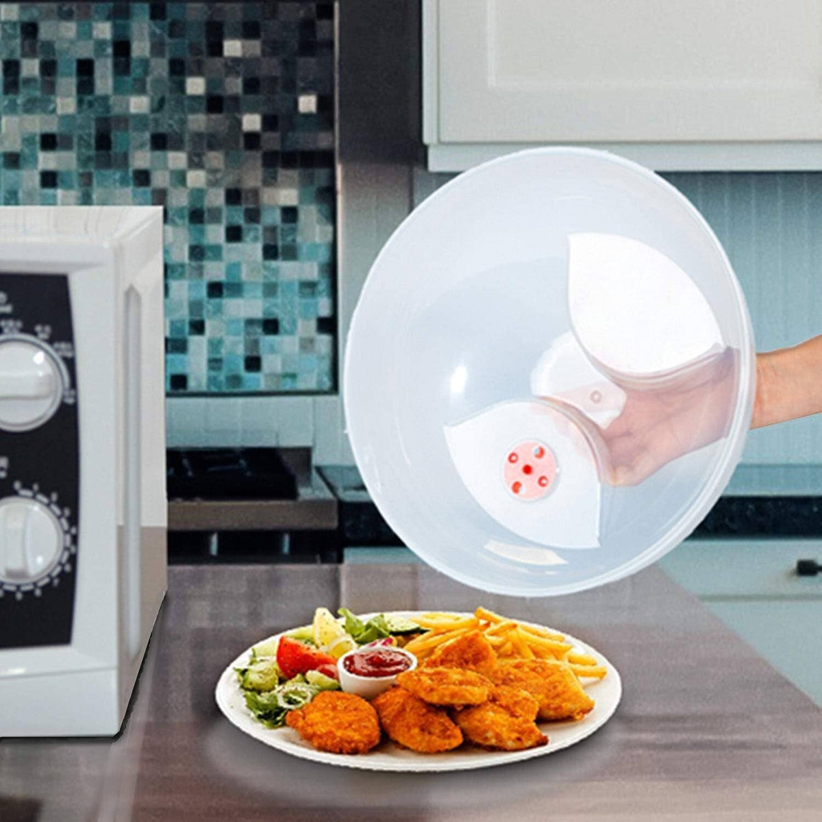 Clear round microwave splatter cover dome with red vent over plated food