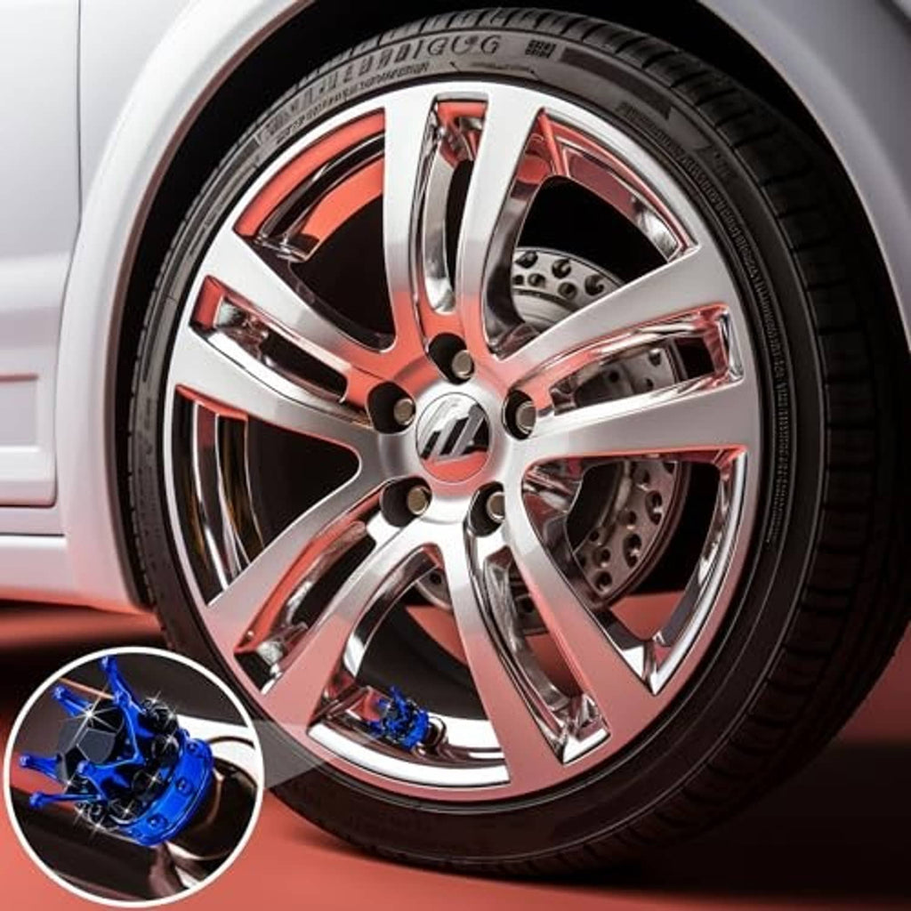 Blue crown tire valve stem cap with black faceted crystals, inset on chrome wheel