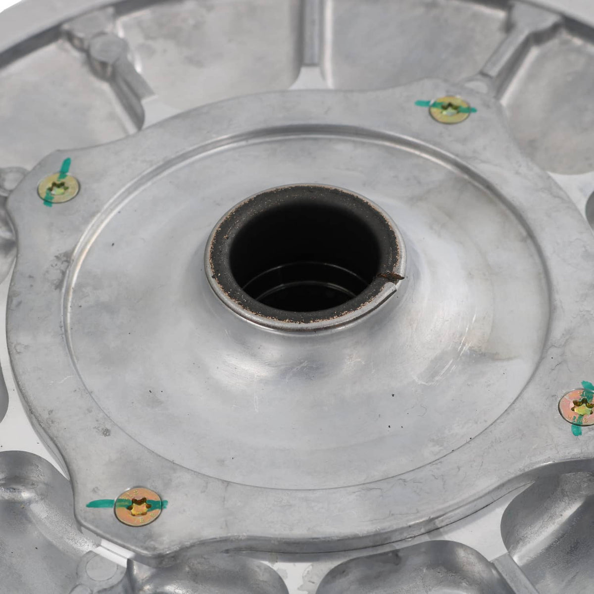 Secondary driven clutch sheave center hub, black bore with worn metal edge