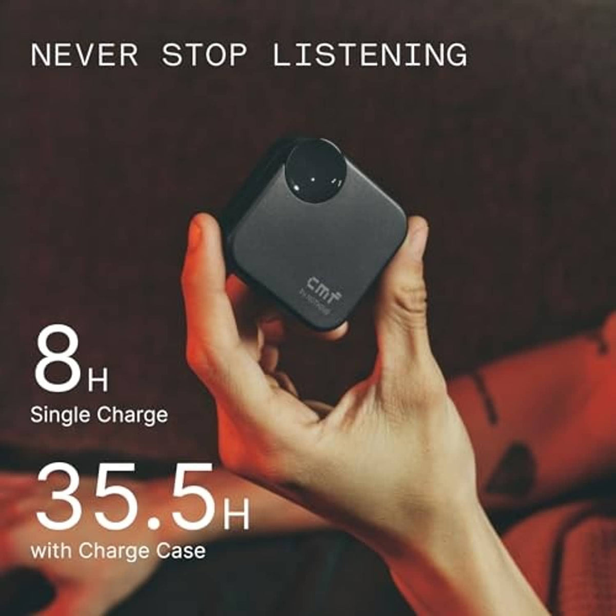 Dark grey wireless earbuds charging case held in hands