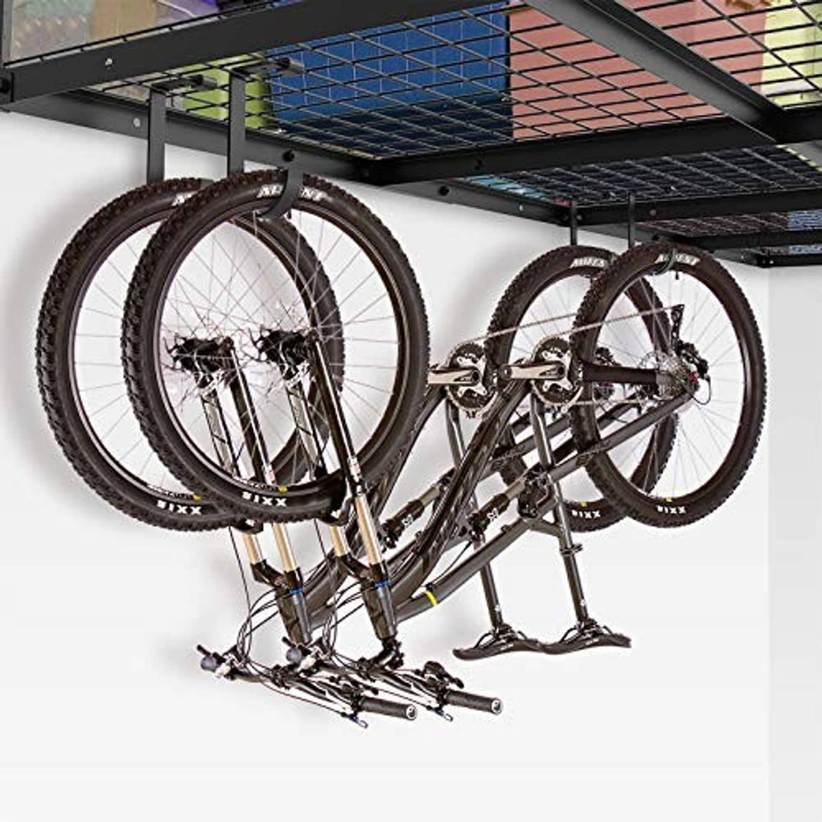 Bicycle hanging under a ceiling wire storage rack with a black flat-top hook