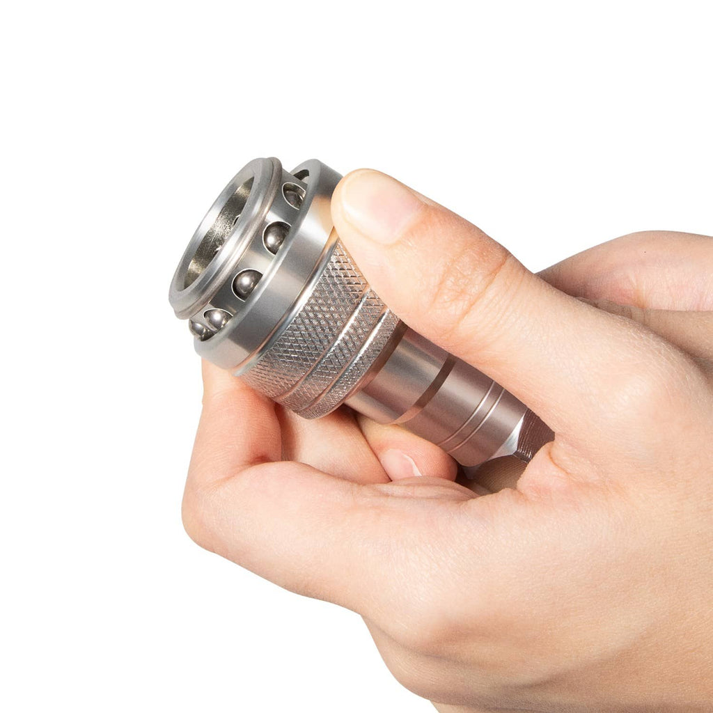 Hydraulic gauge fitting with threaded metal coupler held in hand