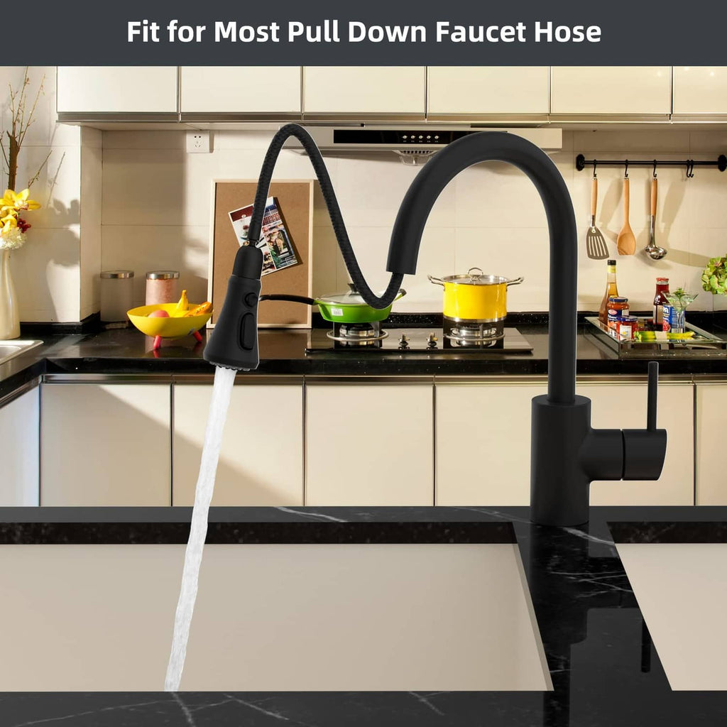 Matte black pull-down kitchen faucet spraying water into sink
