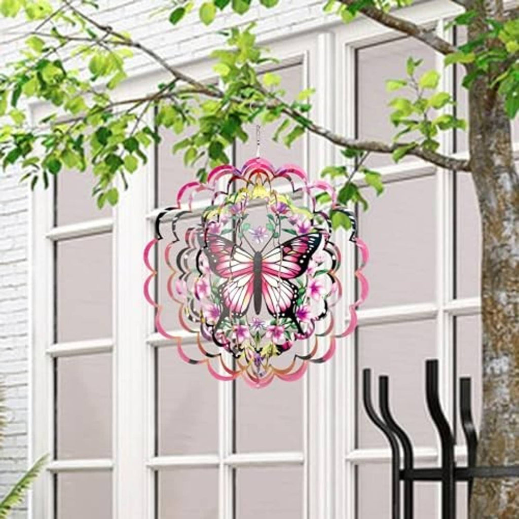 Hanging butterfly wind spinner with pink, purple, and green floral details, layered circular design.