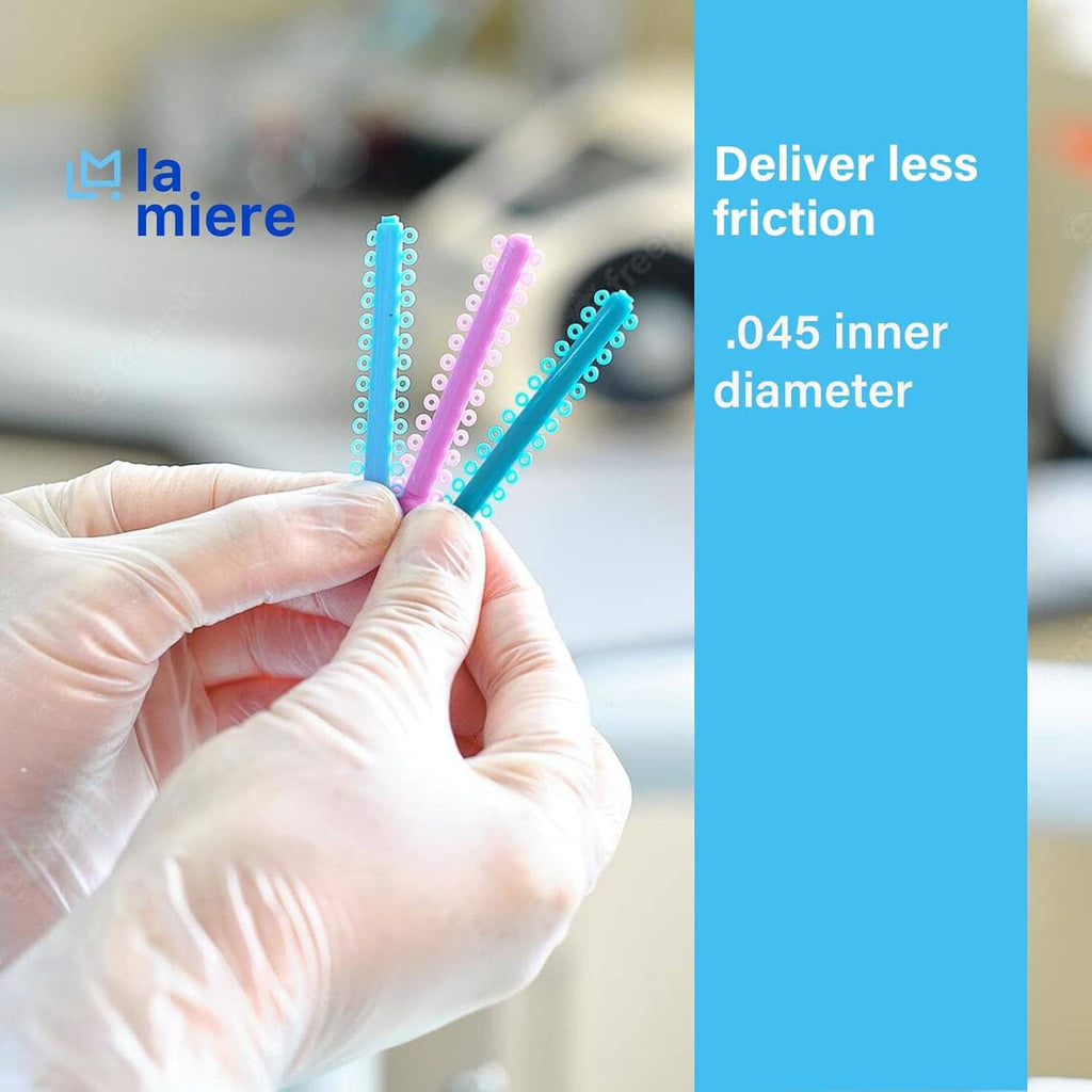 Orthodontic elastic ligature ties held in hand with blue and teal stick loops
