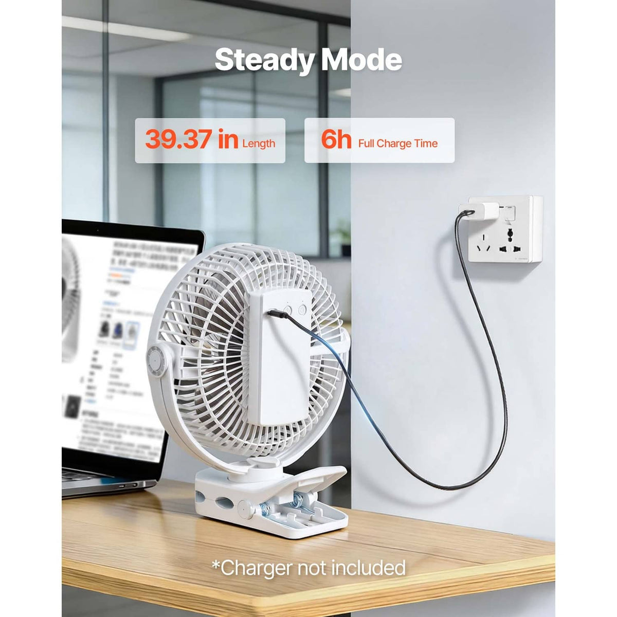 White portable USB fan plugged in, front grille facing left on a desk stand