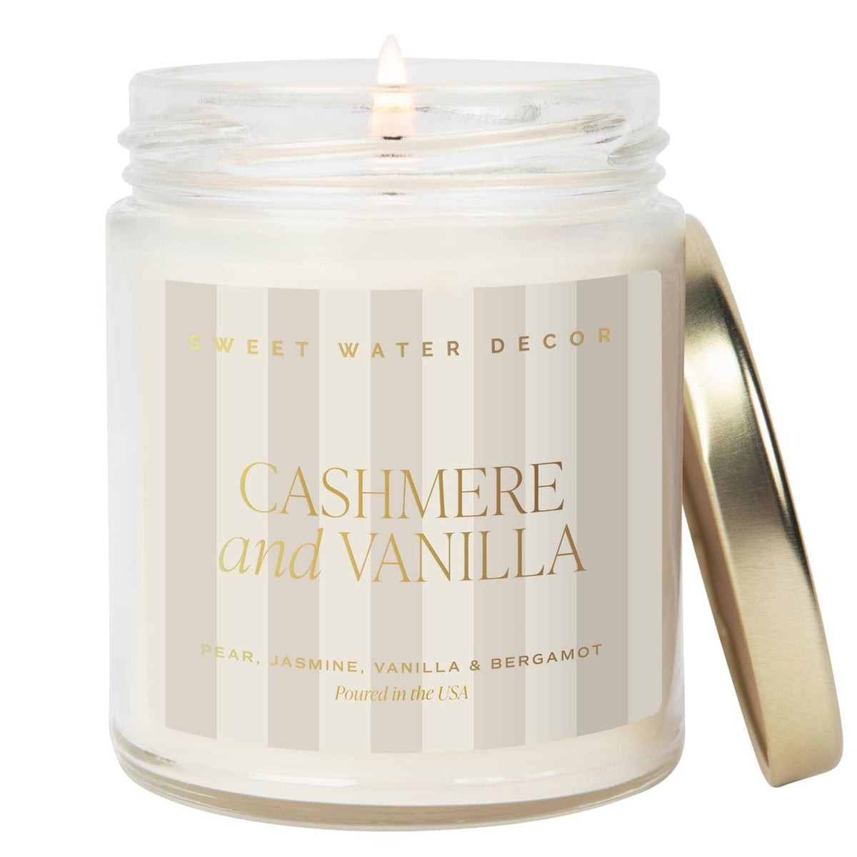 Clear cashmere and vanilla candle in glass jar with lit wick; screw-top lid