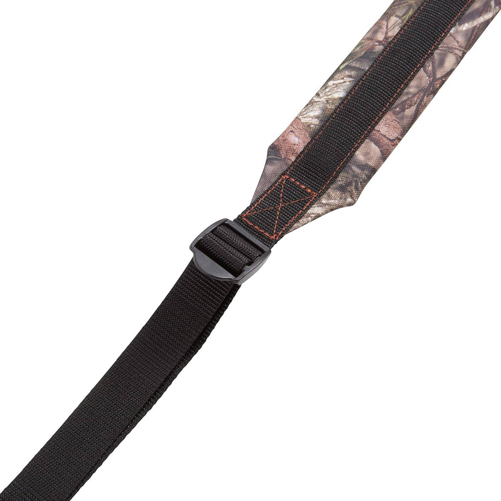 Close-up of padded gun sling strap: black webbing with camouflage fabric near buckle end