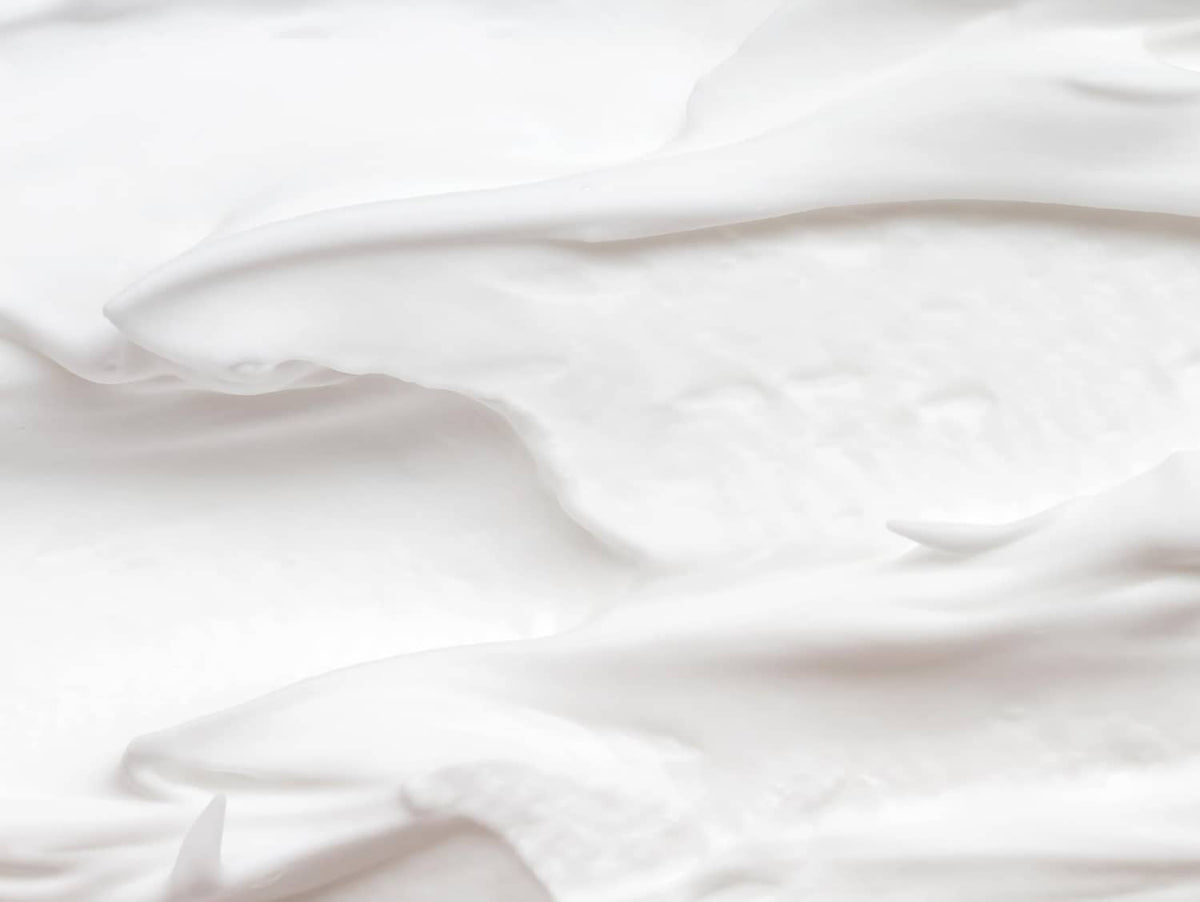 Diaper rash cream shown with a soft white cloth surface