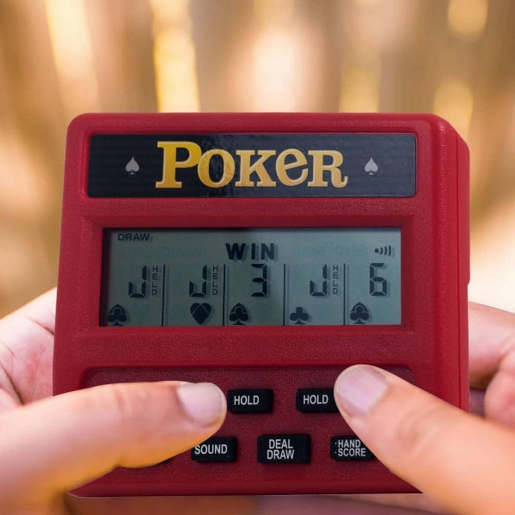 Red handheld poker game close-up with fingers pressing hold controls under LCD win display.