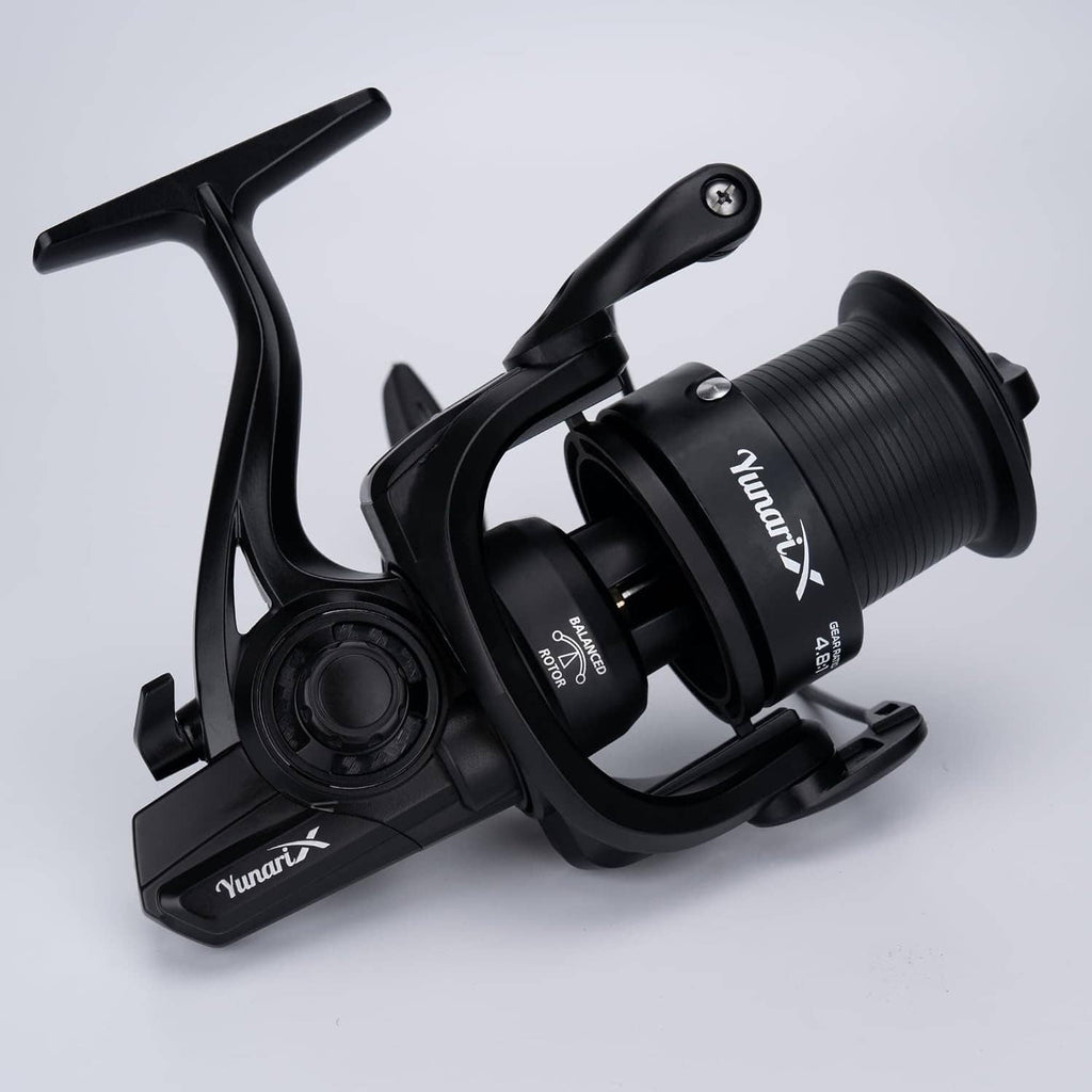 Black spinning fishing reel 3/4 view with large ribbed spool and bail arm