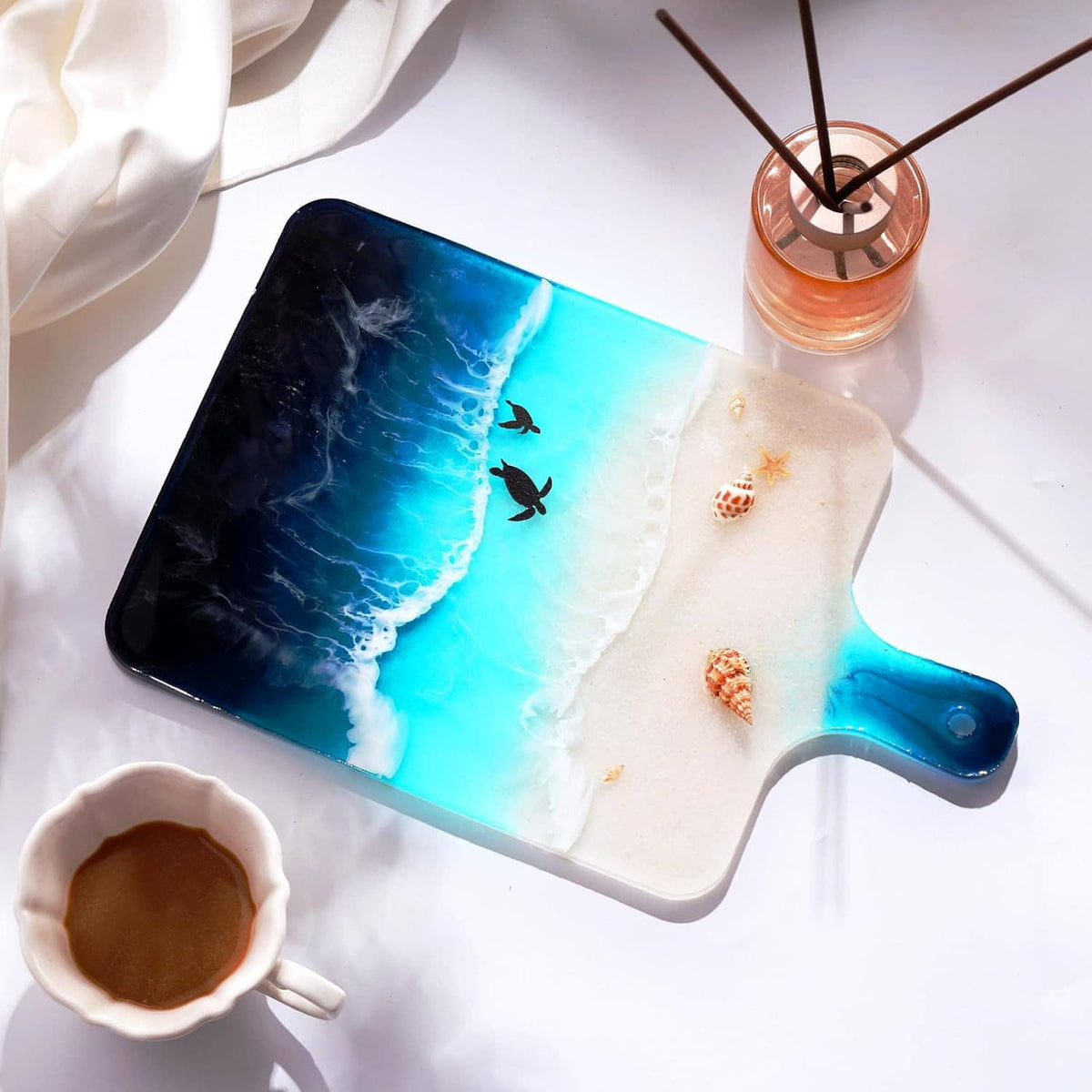 Rectangle resin tray mold with blue and white marbled surface and starfish details