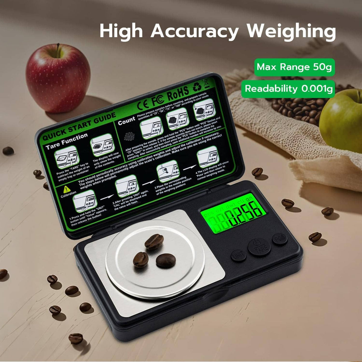 Black mini digital milligram scale with green backlit LCD and stainless steel weighing pan