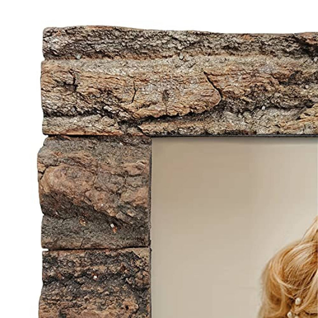 Close-up of rustic bark wood frame edge with rough textured stone-like surface