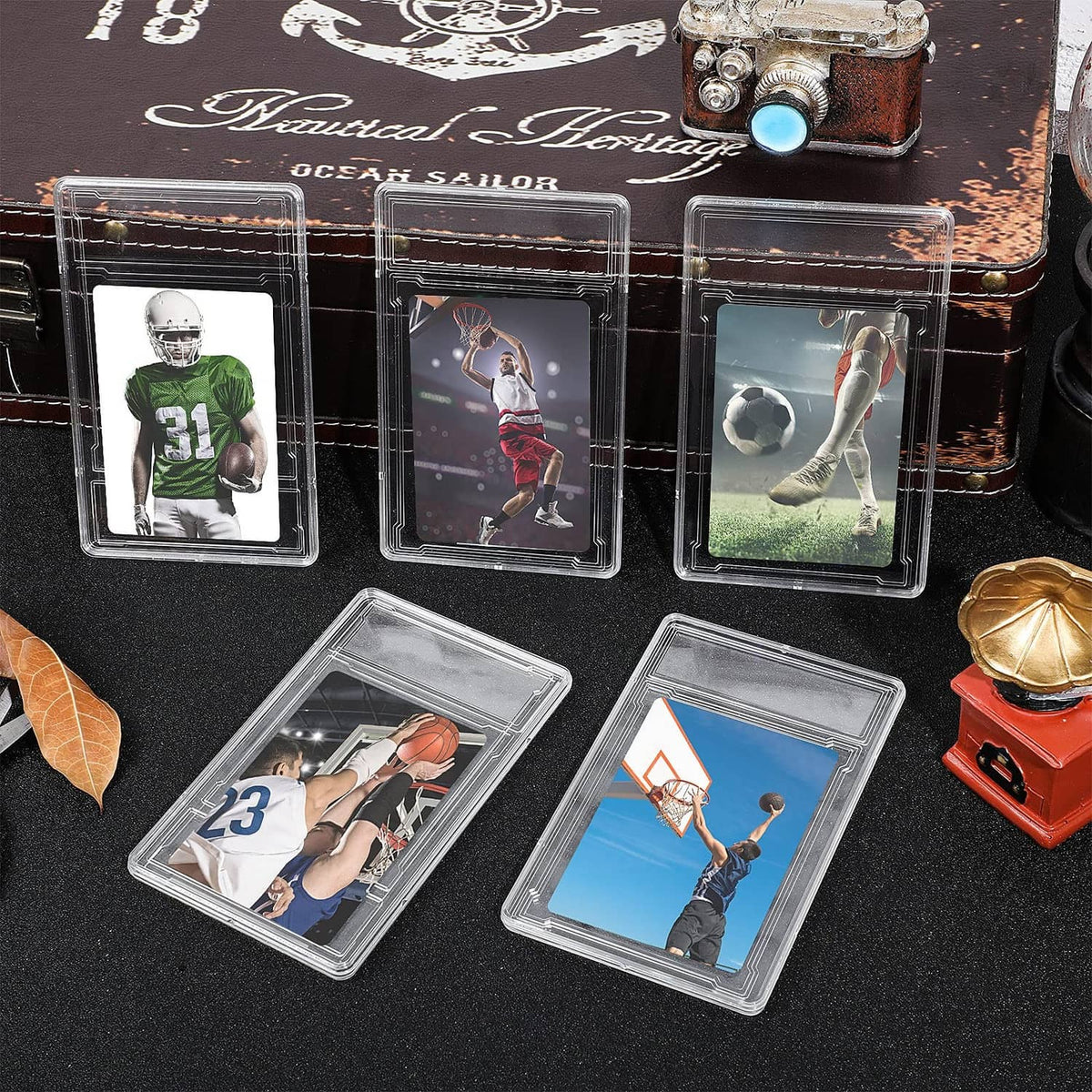 Set of clear acrylic trading card protector cases showing multiple football cards inside.