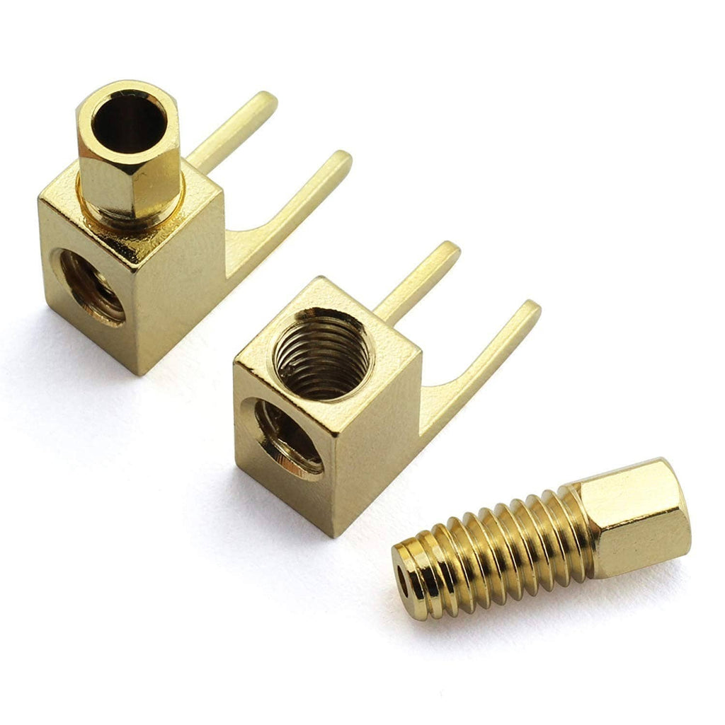 Gold banana-to-spade speaker cable adapters showing fork spade tabs and threaded ends