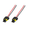 Pair of headlight wiring harness connectors with red/black wires and yellow terminals