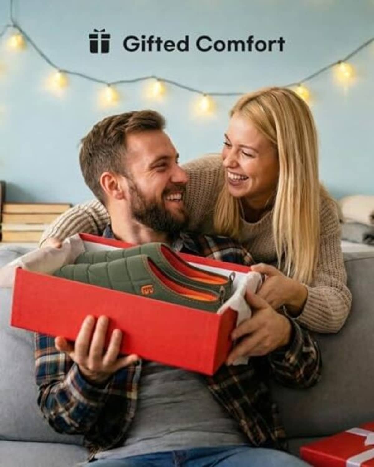 Two-tone slip-on slippers, dark green with brown trim, shown in open shoe box