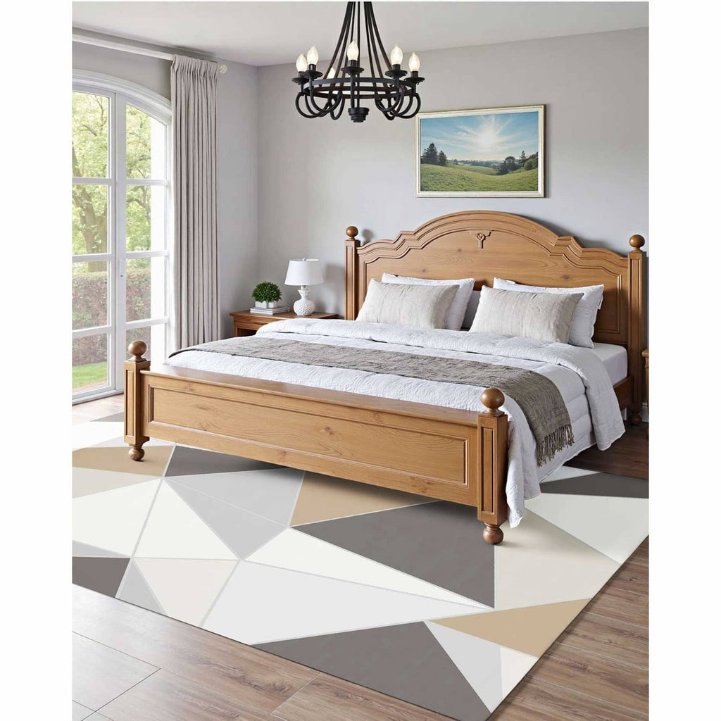 Geometric indoor area rug with charcoal gray, beige, and white triangular design