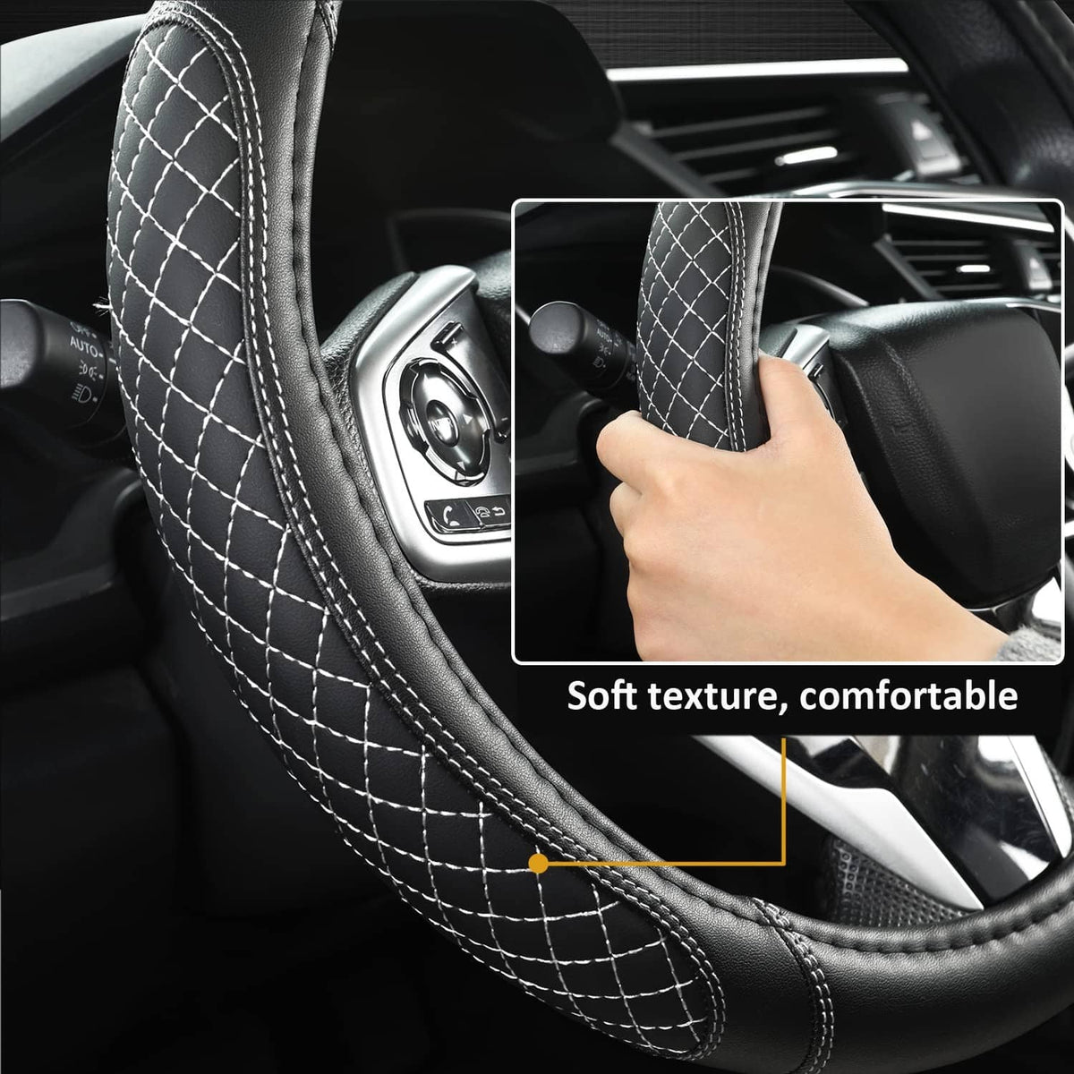 Close-up of black steering wheel cover stitching and grip texture with hand on rim