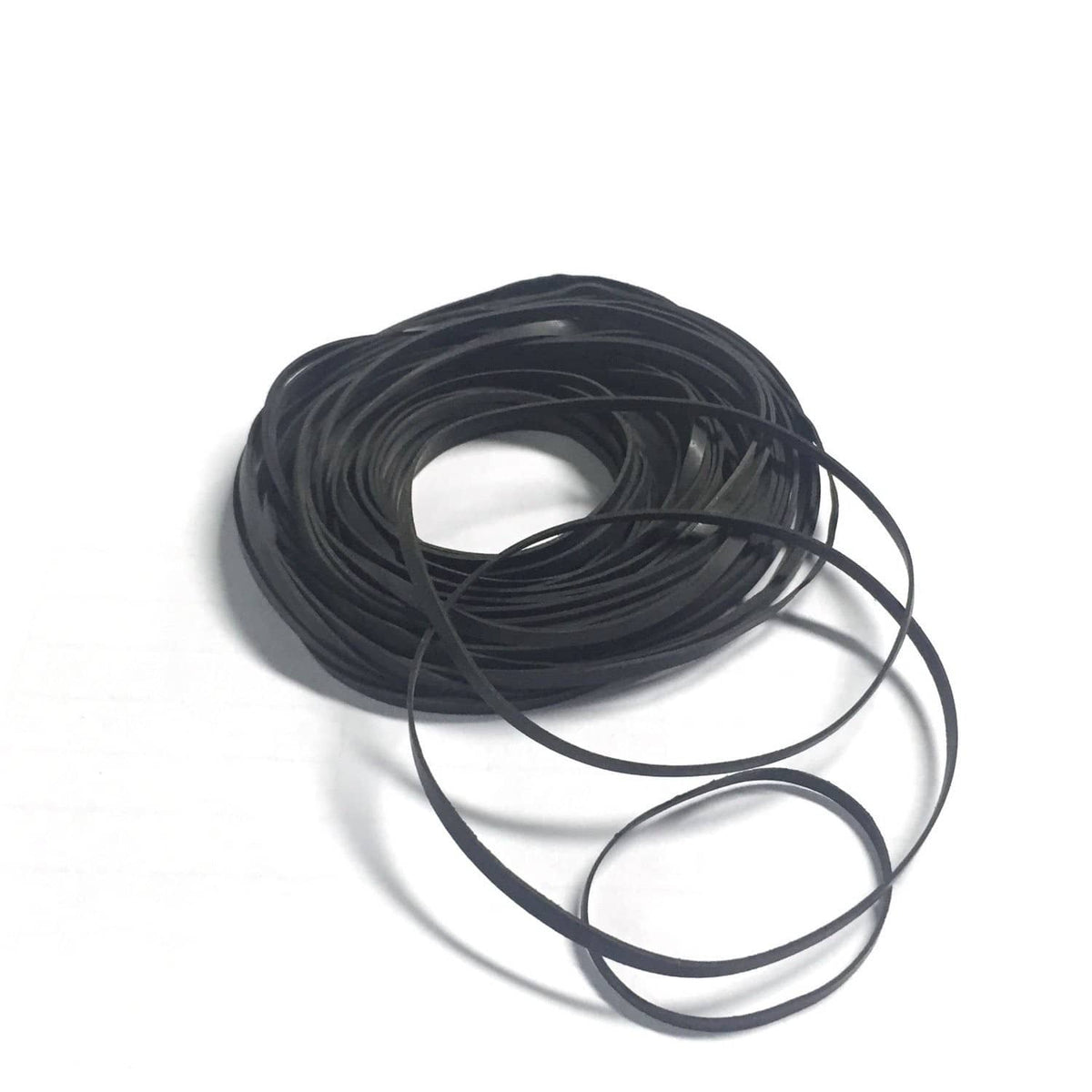 Black rubber flat belts, coiled roll for cassette belt drive repair