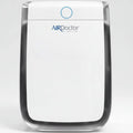 AirDoctor white air purifier with rounded body and blue power ring