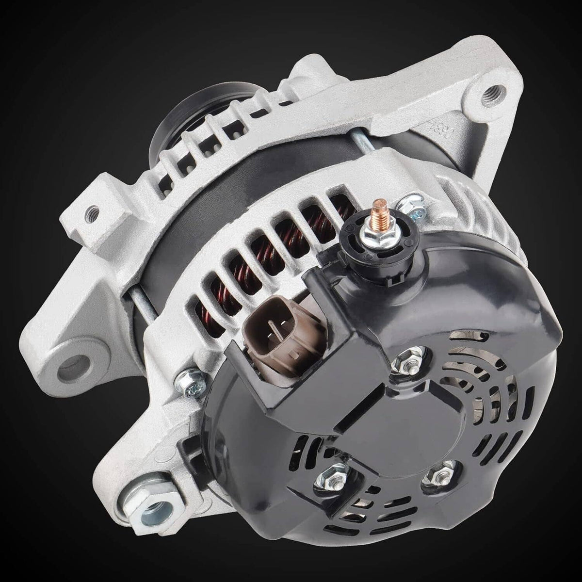 Automotive alternator close-up with vented front housing and top electrical terminal