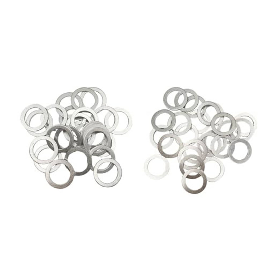 Oil drain plug crush washers set of round metal rings in a scattered pile