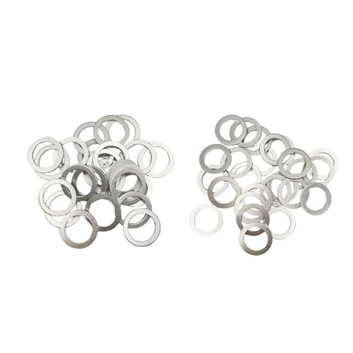Oil drain plug crush washers set of round metal rings in a scattered pile