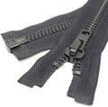Separating zipper with dark fabric tape, black metal teeth, and two-part pull slider.