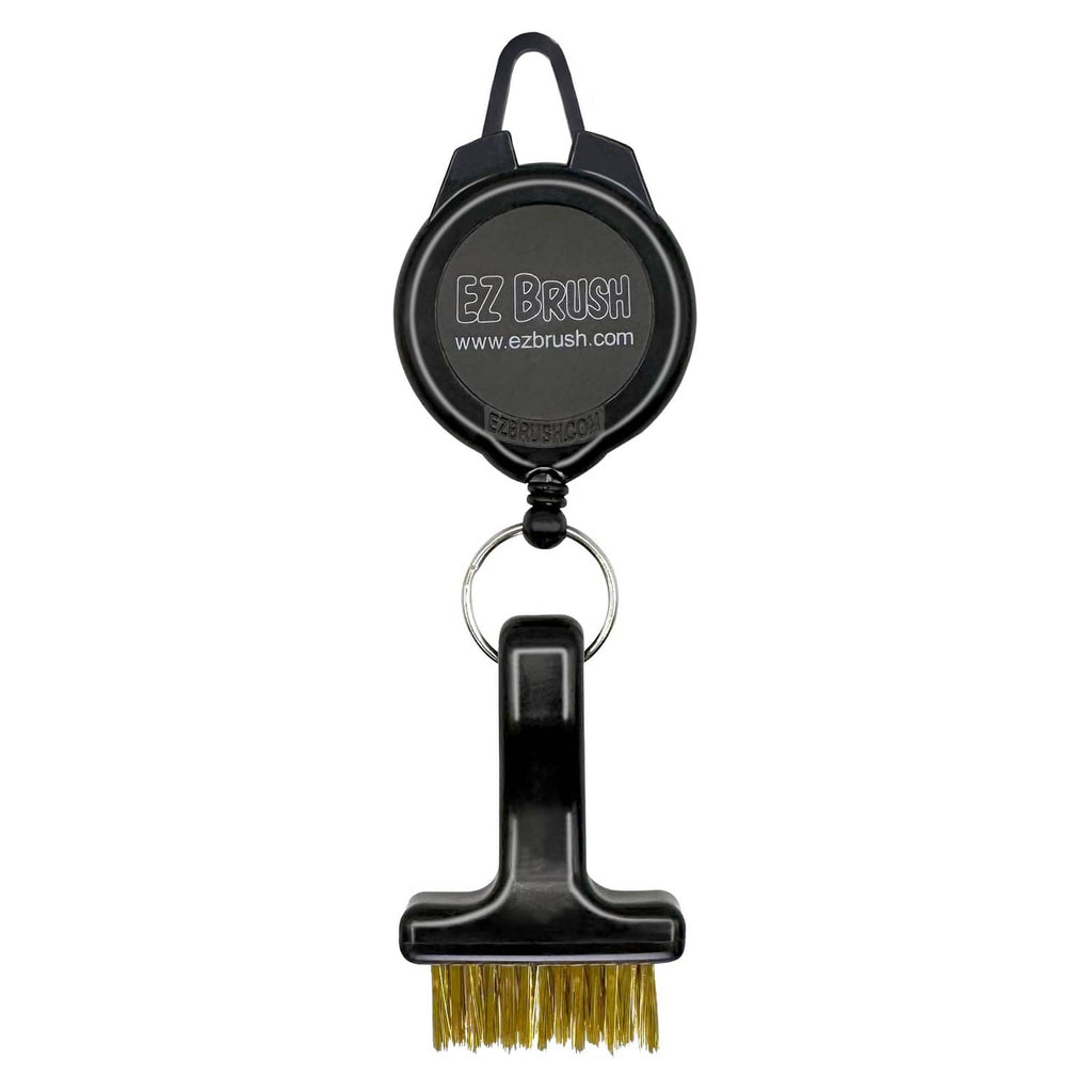 Retractable black EZ BRUSH golf cleaning tool with gold bristle head and keyring.